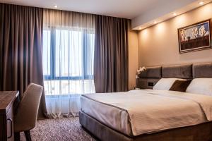 Ένα ή περισσότερα κρεβάτια σε δωμάτιο στο NEW Garni Hotel FILIA