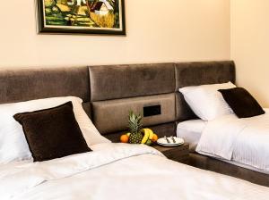 Ένα ή περισσότερα κρεβάτια σε δωμάτιο στο NEW Garni Hotel FILIA