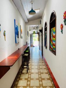 a long corridor with a bar in a building at Pousada Berimbau in Arraial d'Ajuda