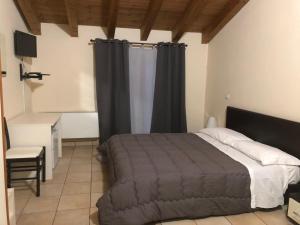A bed or beds in a room at IL Borgo