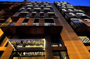 a tall building with a sign on the side of it at Europark in Barcelona