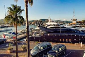 a group of cars parked in a marina with boats at Modern Appartement - Les Pieds dans l'Eau - Saint-Tropez 4 in Cogolin