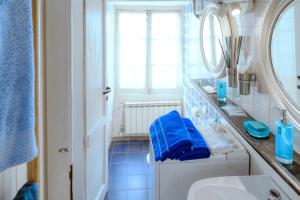 a bathroom with a white sink and a mirror at IVANA Apartment in Levanto +11 photos
