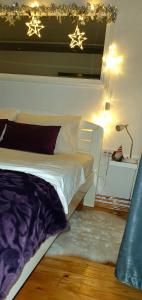 Ένα ή περισσότερα κρεβάτια σε δωμάτιο στο Apartman Ena