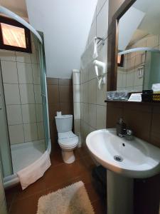 Koupelna v ubytování Hotel Tara