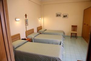 Postel nebo postele na pokoji v ubytování Casa Piccole Ancelle di Cristo Re