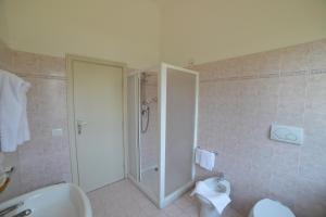 a bathroom with a shower and a toilet at Casa Piccole Ancelle di Cristo Re in Rome
