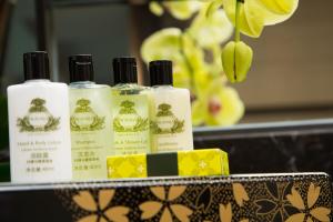 a group of four bottles of soap on a counter at InterContinental San Diego, an IHG Hotel in San Diego