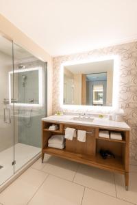 a bathroom with a sink and a shower at InterContinental San Diego by IHG in San Diego