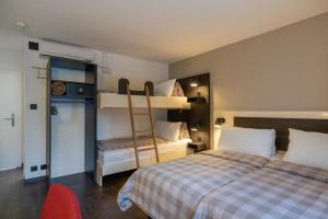 
Ein Etagenbett oder Etagenbetten in einem Zimmer der Unterkunft Hotel Derby
