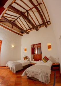 Voodi või voodid majutusasutuse Hotel Marquesa de Pinares toas