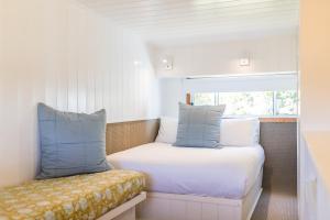 A bed or beds in a room at Surfside Cudmirrah Beach