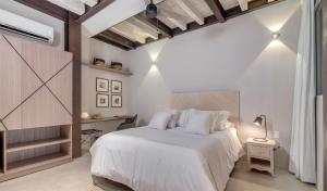 Postel nebo postele na pokoji v ubytování Lunalá Hotel Boutique