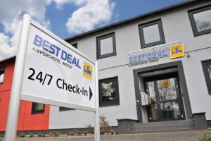a building with a sign in front of it at Best Deal Airporthotel Weeze in Weeze