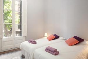 A bed or beds in a room at Modernist Apartment Barcelona