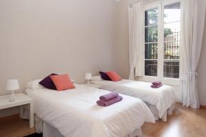 Postel nebo postele na pokoji v ubytování Modernist Apartment Barcelona