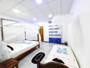 Letto o letti in una camera di Galaxy View Homestay Sigiriya