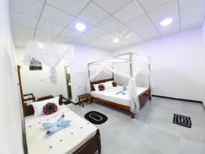 Letto o letti in una camera di Galaxy View Homestay Sigiriya