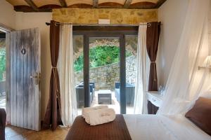 Katil atau katil-katil dalam bilik di Hotel Rural & Spa Mas Prat