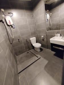 a bathroom with a shower and a toilet and a sink at Ava Empire Damansara FRESH Room Everything Young in Petaling Jaya