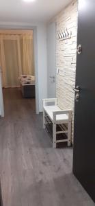 a room with a door and a room with a bed at Silver Apartman in Siófok
