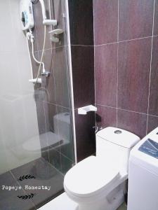 a bathroom with a toilet and a glass shower at Luxury Premium Suite @ Kempas Johor Bahru in Johor Bahru +24 photos