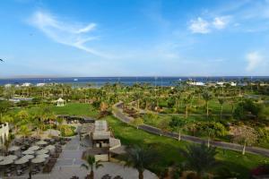 an aerial view of a resort with palm trees and the ocean at Steigenberger Aldau Beach Hotel in Hurghada