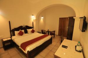 Voodi või voodid majutusasutuse Rangmahal Pushkar by DIV HOSPITALITY toas
