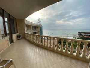 a balcony of a hotel with a view of the ocean at Dolphin Resort by Stellar Hotels, Sochi in Sochi