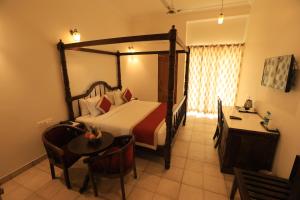 Voodi või voodid majutusasutuse Rangmahal Pushkar by DIV HOSPITALITY toas
