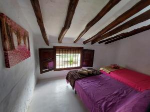 Postel nebo postele na pokoji v ubytování Luby Cortijo Las Eras