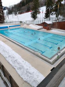 The swimming pool at or close to Corbier centre Vostok 32m2 balcon Sud vue pistes Classé Tourisme