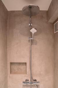 a shower in a bathroom with a ceiling at Studio47 in Ostend