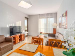 Telewizja i/lub zestaw kina domowego w obiekcie 3L Apartments Olympic Park