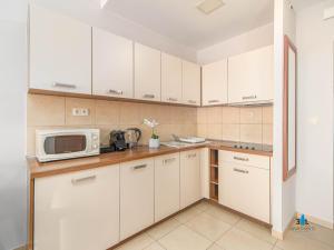 Kuchnia lub aneks kuchenny w obiekcie 3L Apartments Olympic Park