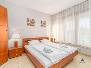 Łóżko lub łóżka w pokoju w obiekcie 3L Apartments Olympic Park