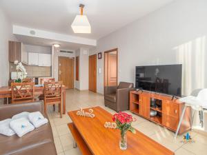Telewizja i/lub zestaw kina domowego w obiekcie 3L Apartments Olympic Park