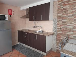Kuhinja oz. manjša kuhinja v nastanitvi Quinta da Fonte da Poça - Chalé T1