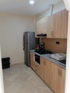 Η κουζίνα ή μικρή κουζίνα στο Appartements a Imi Ouaddar proche de la Plage