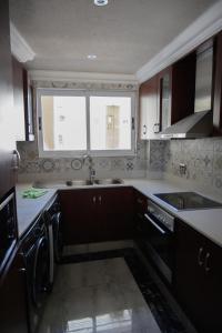 a kitchen with a sink and a window at Apartment C307 at The Sails in Durban