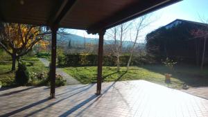 a screened porch with a view of a garden at Morrovalle LOVE in Morrovalle