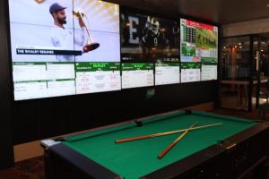 a pool table with two baseball bats on top of it at Hurstville Ritz Hotel in Sydney