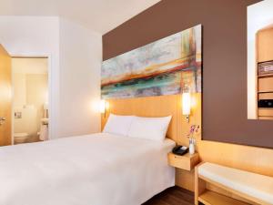 Voodi või voodid majutusasutuse Ibis One Central - World Trade Centre Dubai toas