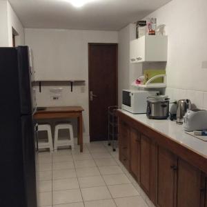 a kitchen with a sink and a counter top at Habitaciones en San Isidro in Lima +5 photos