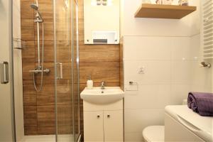 Kúpeľňa v ubytovaní Apartament Lawendowy