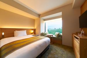 Giường trong phòng chung tại Fujisan Mishima Tokyu Hotel
