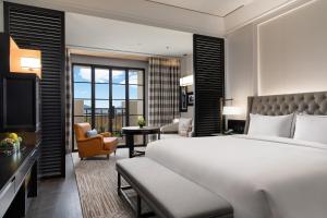 Letto o letti in una camera di Suning Zhongshan Golf Resort