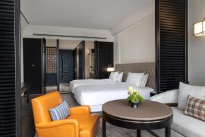 Letto o letti in una camera di Suning Zhongshan Golf Resort