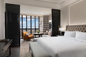Letto o letti in una camera di Suning Zhongshan Golf Resort