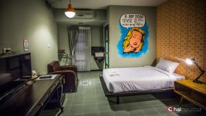 Postel nebo postele na pokoji v ubytování The 8 Factory Hotel Phitsanulok